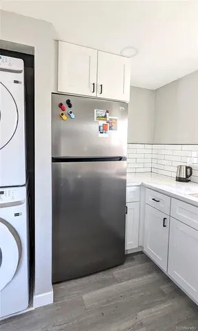 a white refrigerator freezer sitting inside of a kitchen