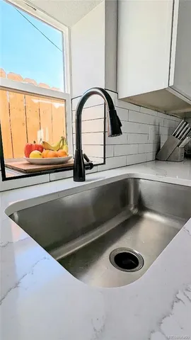 a bedroom with a bed and a night stand