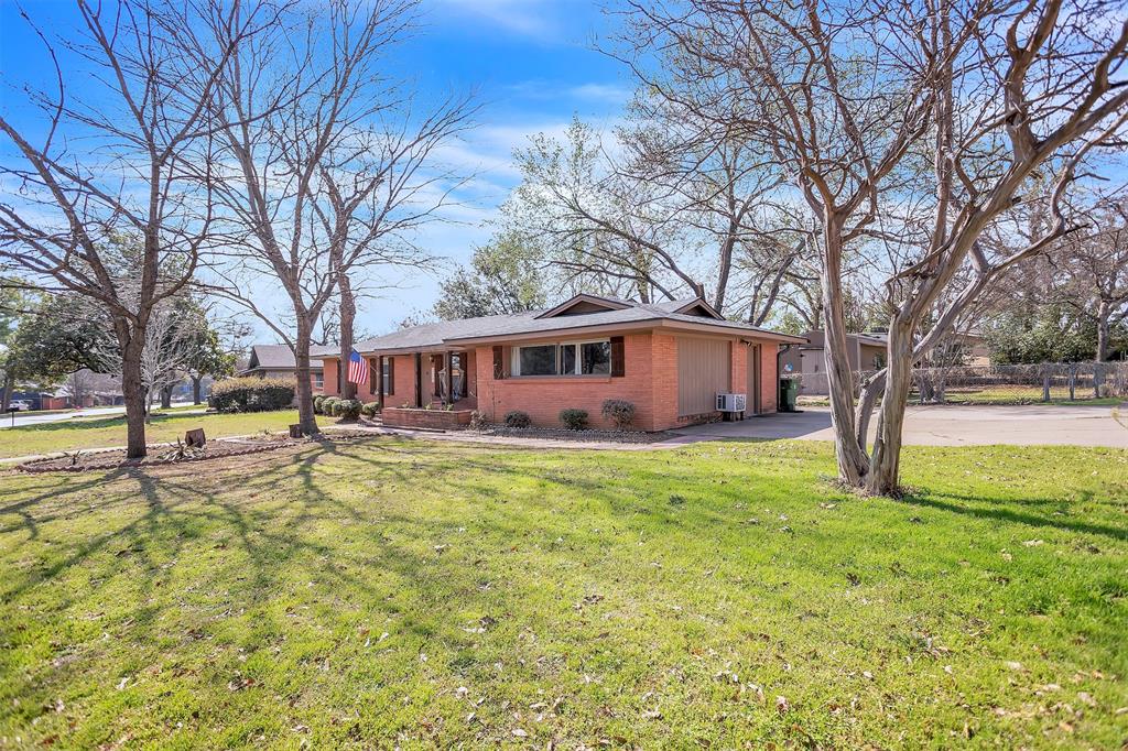 709 Hurstview Drive Hurst, TX 76053 - Photo 27 of 28 a view of a house with a yard covered with large trees