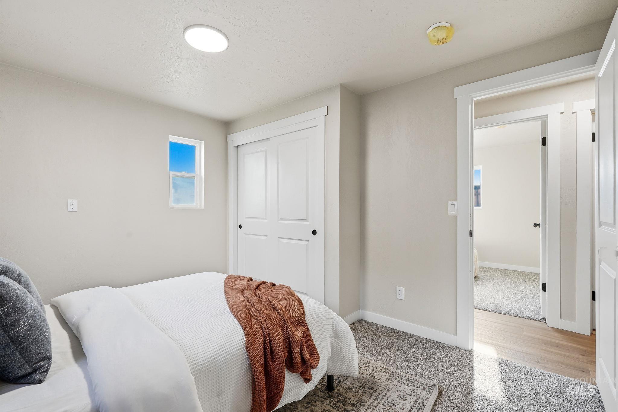 1990 Panama Street Boise, ID 83705 - Photo 36 of 50 Bedroom featuring a rectangular window, light gray wall finishes, recessed ceiling lighting, and a white sliding closet door
