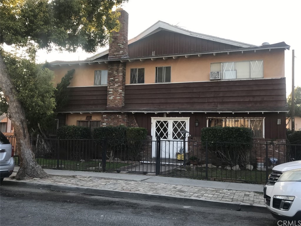 8113 Cypress Avenue, Unit A South Gate, CA 90280 - Photo 1 of 1 a front view of a house with a yard