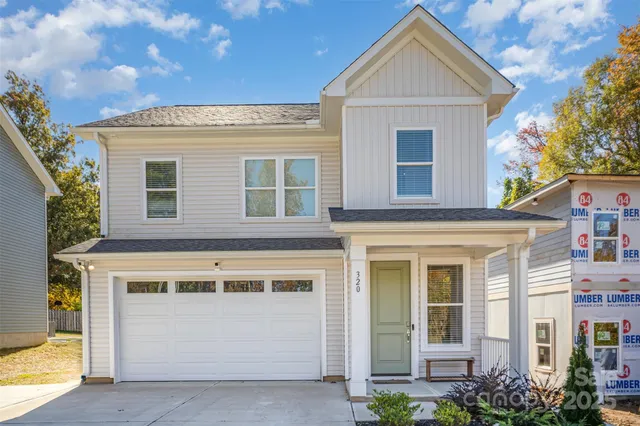 a front view of a house with a garage