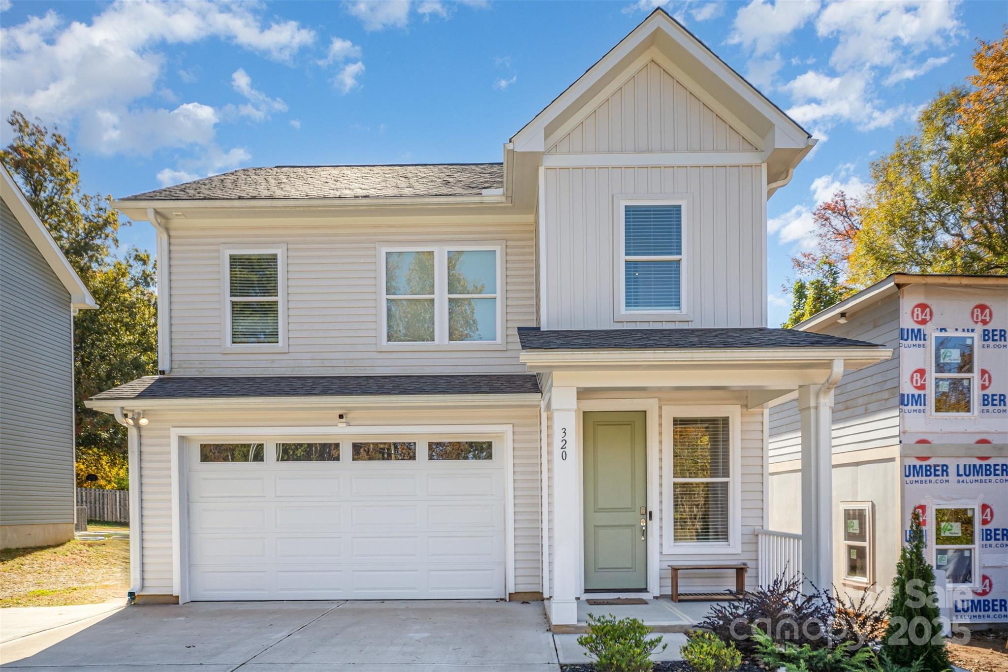 320 Lawrence Gray Road Charlotte, NC 28262 - Photo 1 of 23 a front view of a house with a garage