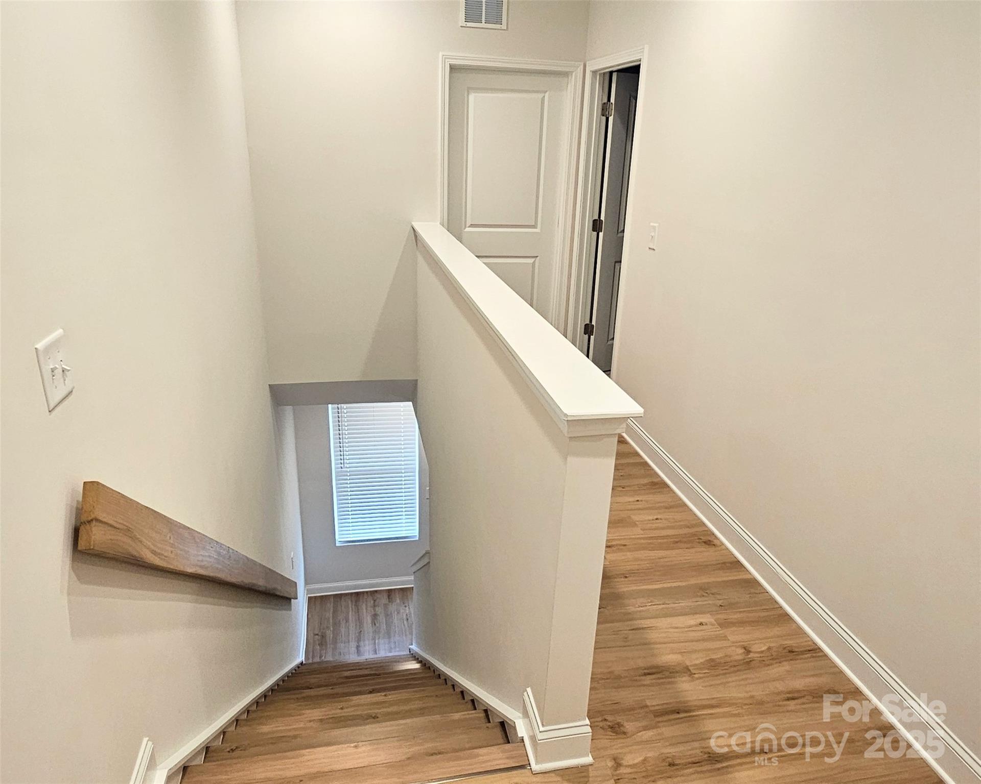 320 Lawrence Gray Road Charlotte, NC 28262 - Photo 11 of 23 a view of staircase with white walls and railing