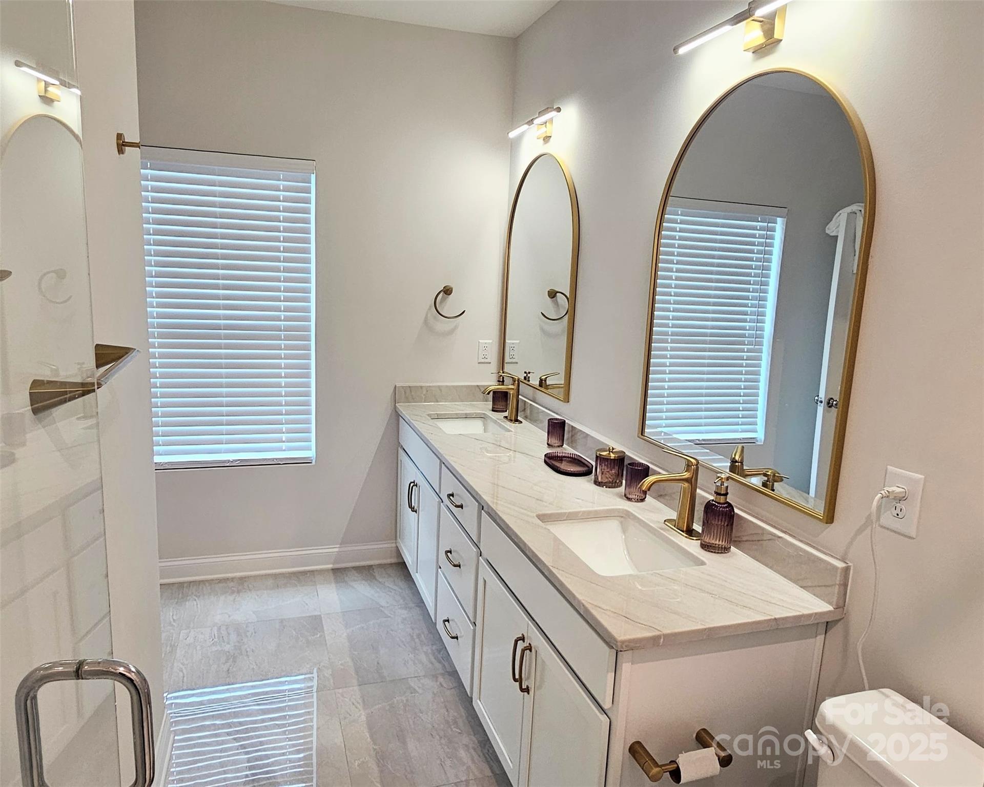 320 Lawrence Gray Road Charlotte, NC 28262 - Photo 14 of 23 a bathroom with a double vanity sink and a mirror