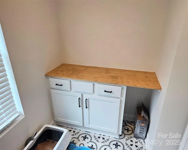 a view of room with wooden floor