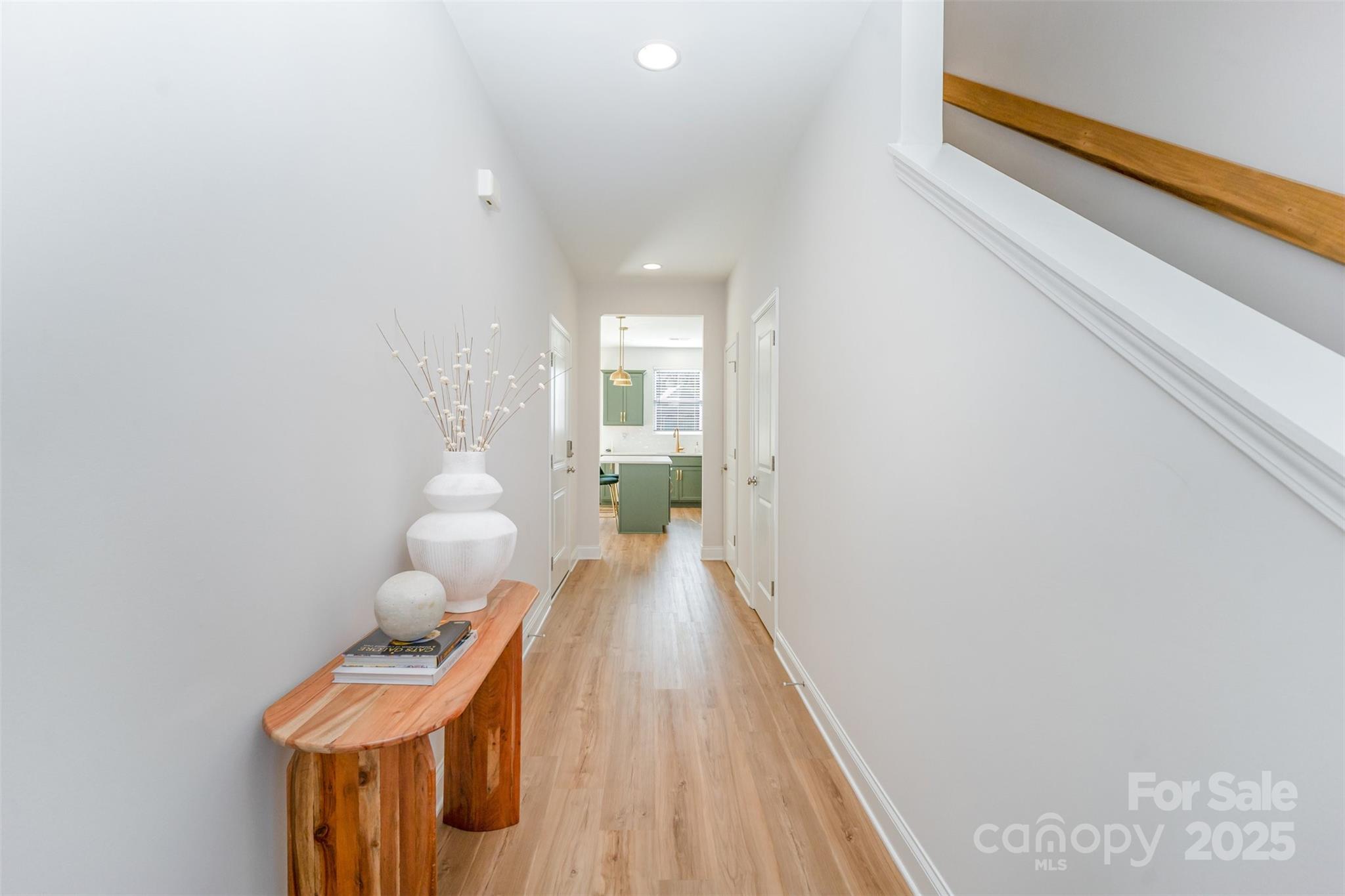 320 Lawrence Gray Road Charlotte, NC 28262 - Photo 2 of 23 a view of a hallway with wooden floor and a bathroom