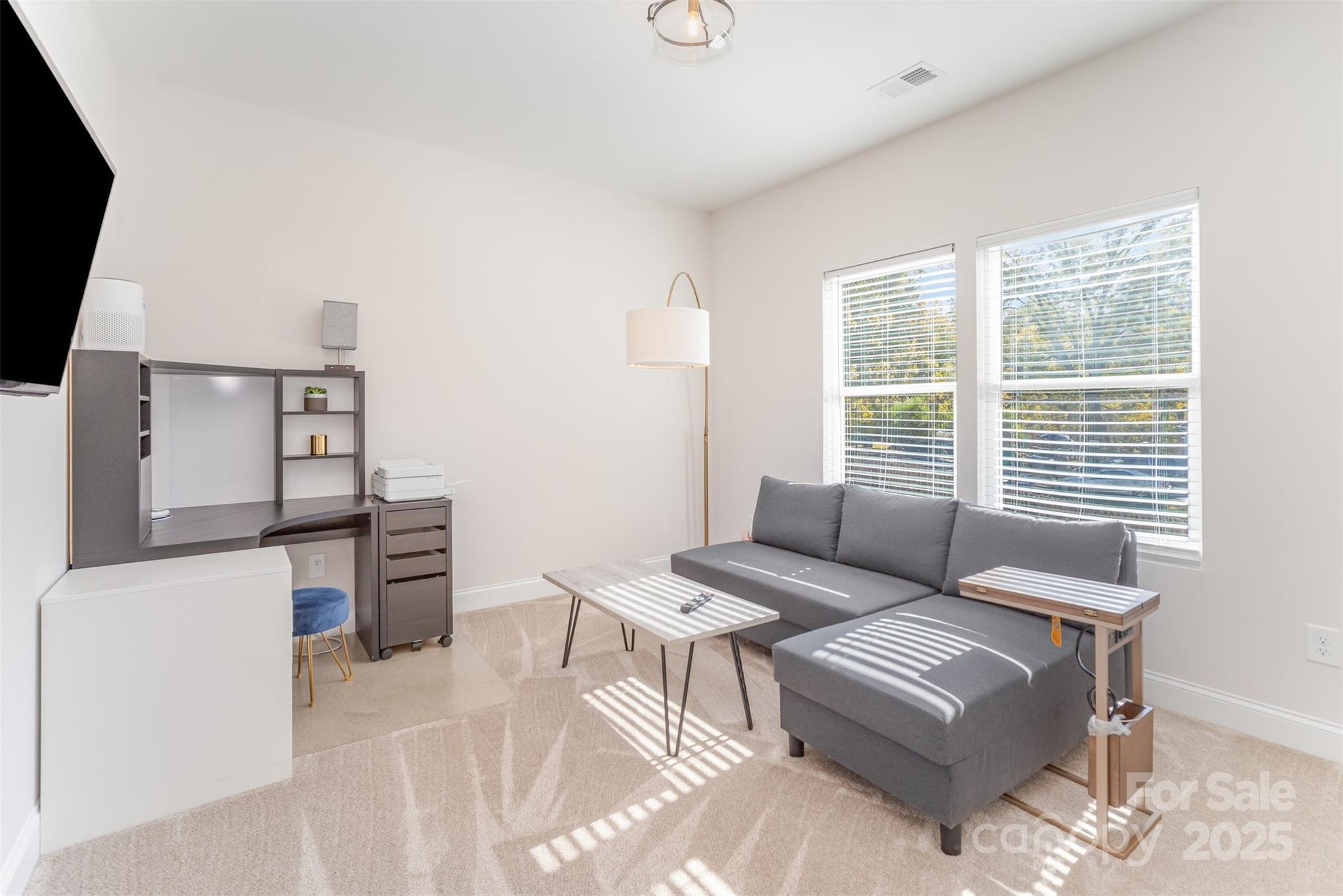320 Lawrence Gray Road Charlotte, NC 28262 - Photo 21 of 23 a living room with furniture a flat screen tv and a window