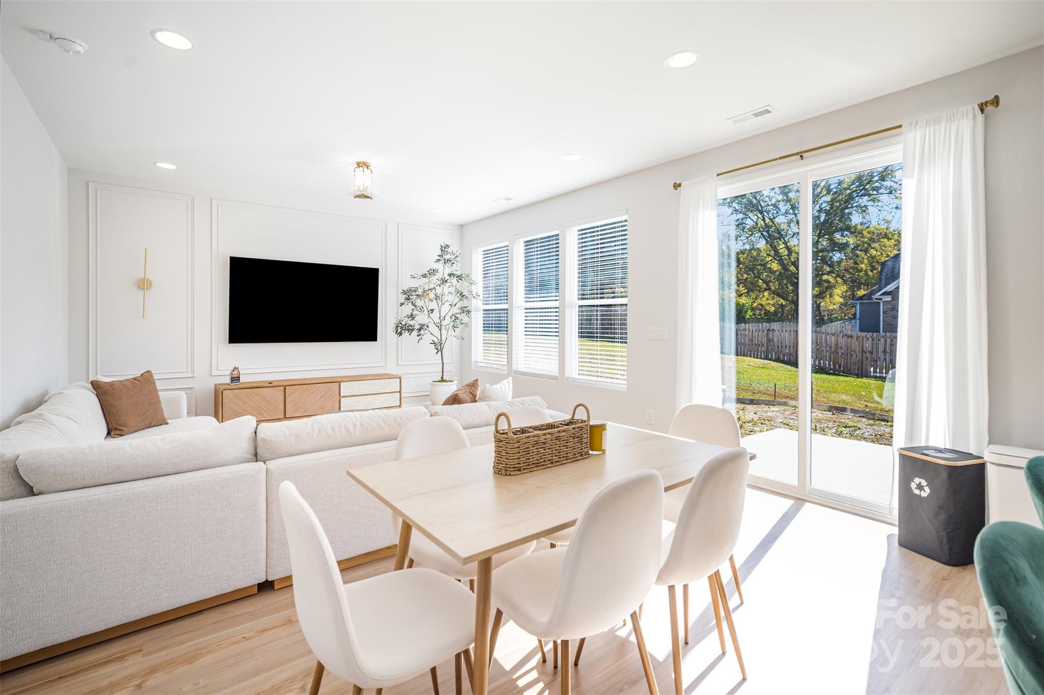 320 Lawrence Gray Road Charlotte, NC 28262 - Photo 3 of 23 a living room with furniture and a flat screen tv