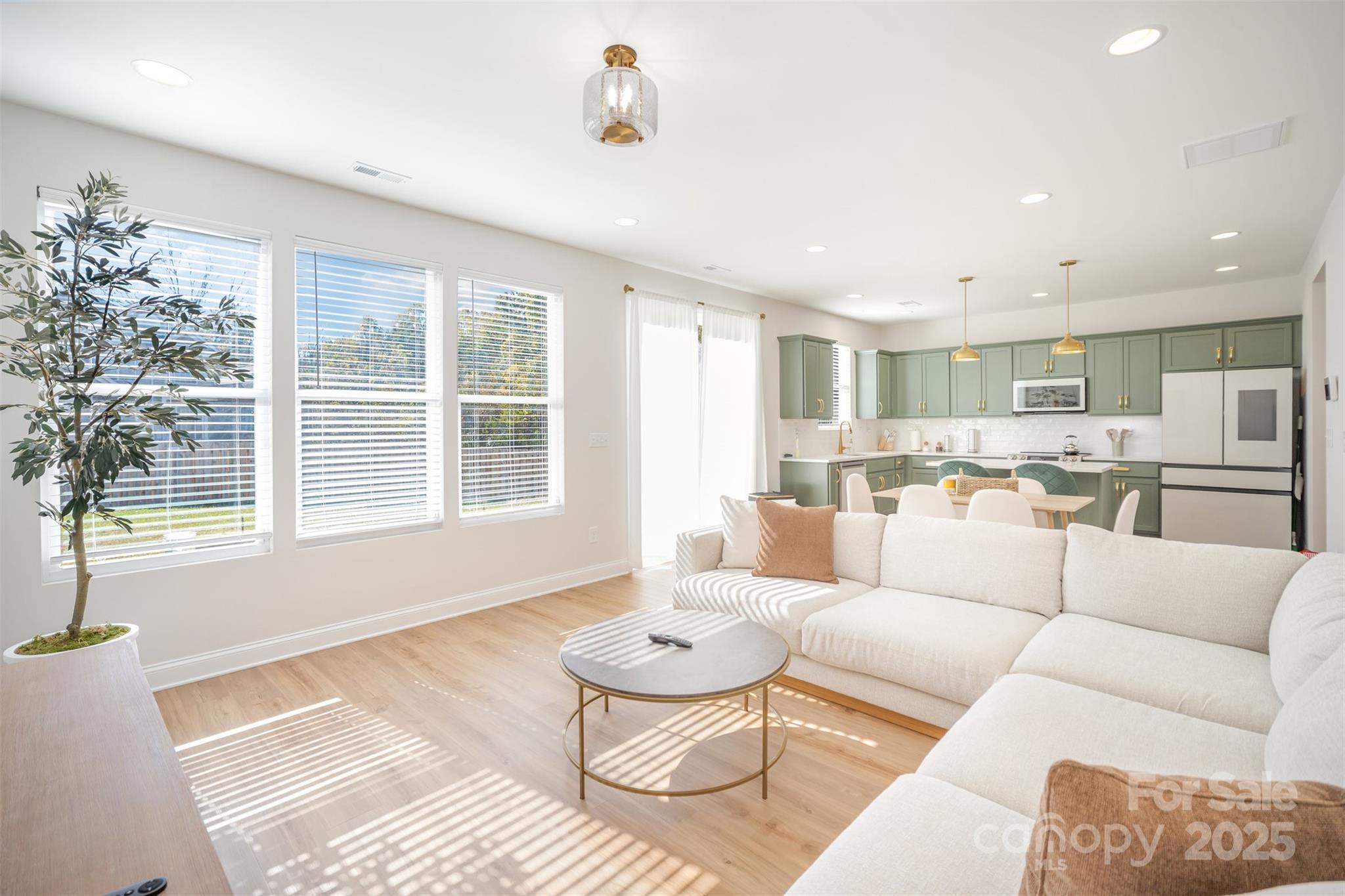 320 Lawrence Gray Road Charlotte, NC 28262 - Photo 4 of 23 a living room with furniture and a large window