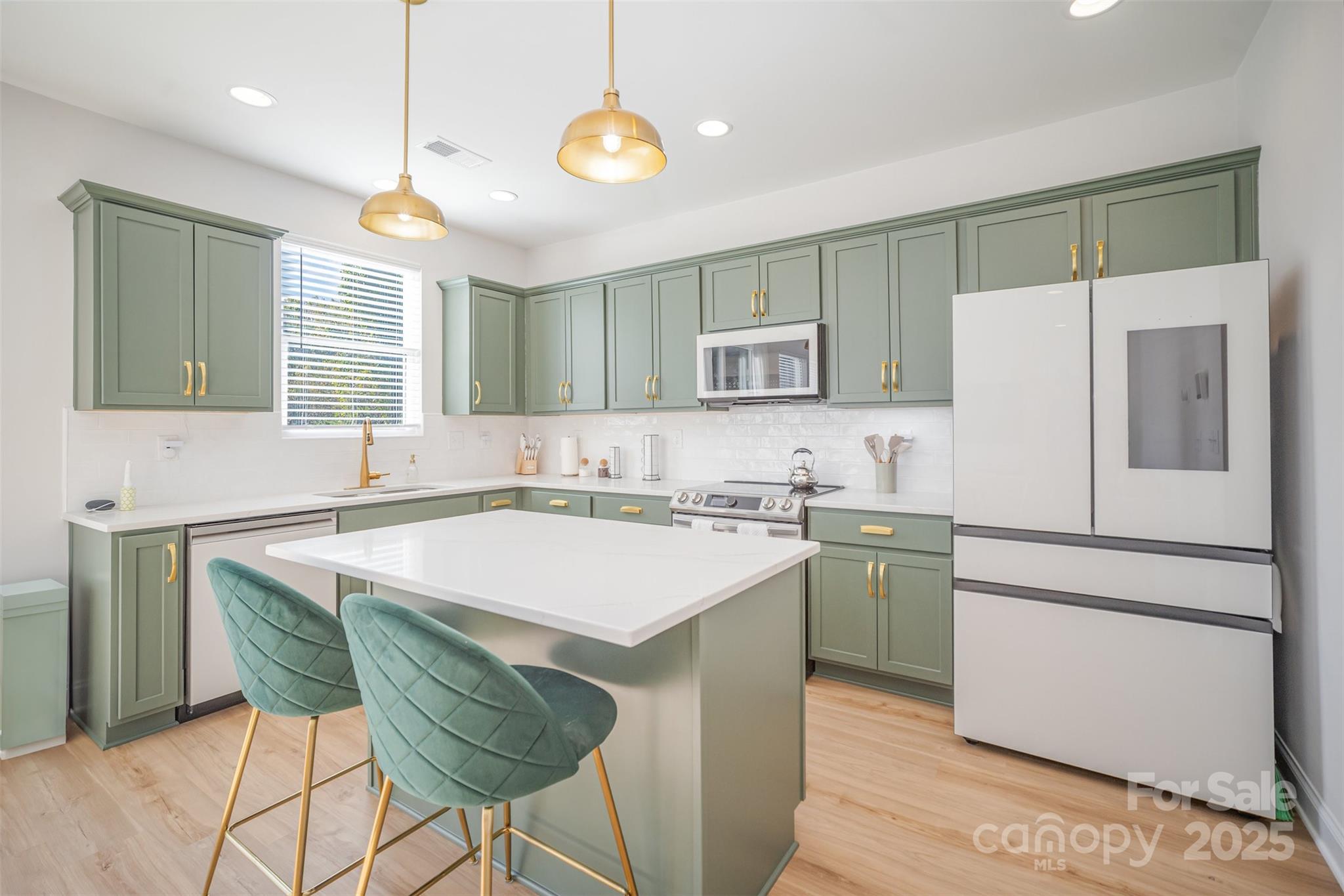 320 Lawrence Gray Road Charlotte, NC 28262 - Photo 6 of 23 a kitchen with a stove a sink and a refrigerator