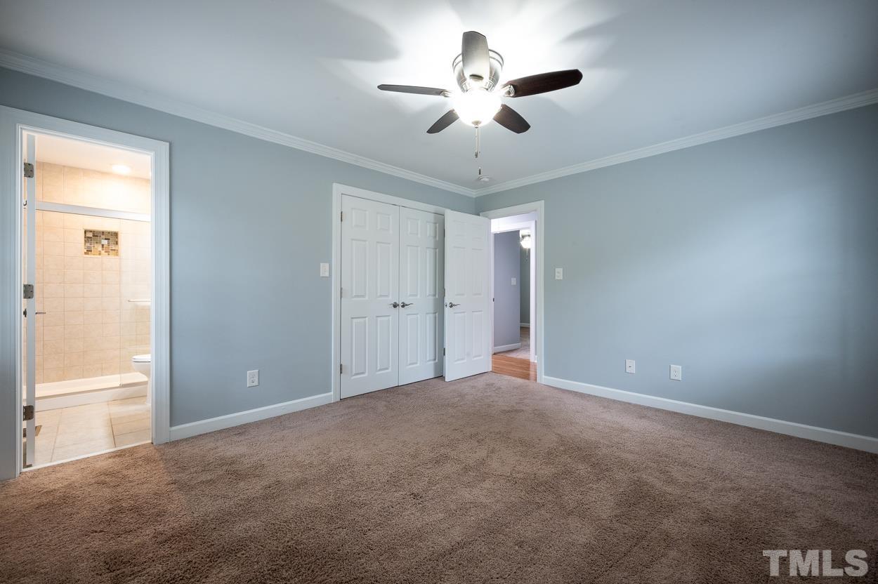 3400 Morningside Drive Raleigh, NC 27607 - Photo 20 of 21 a view of an empty room with a chandelier fan