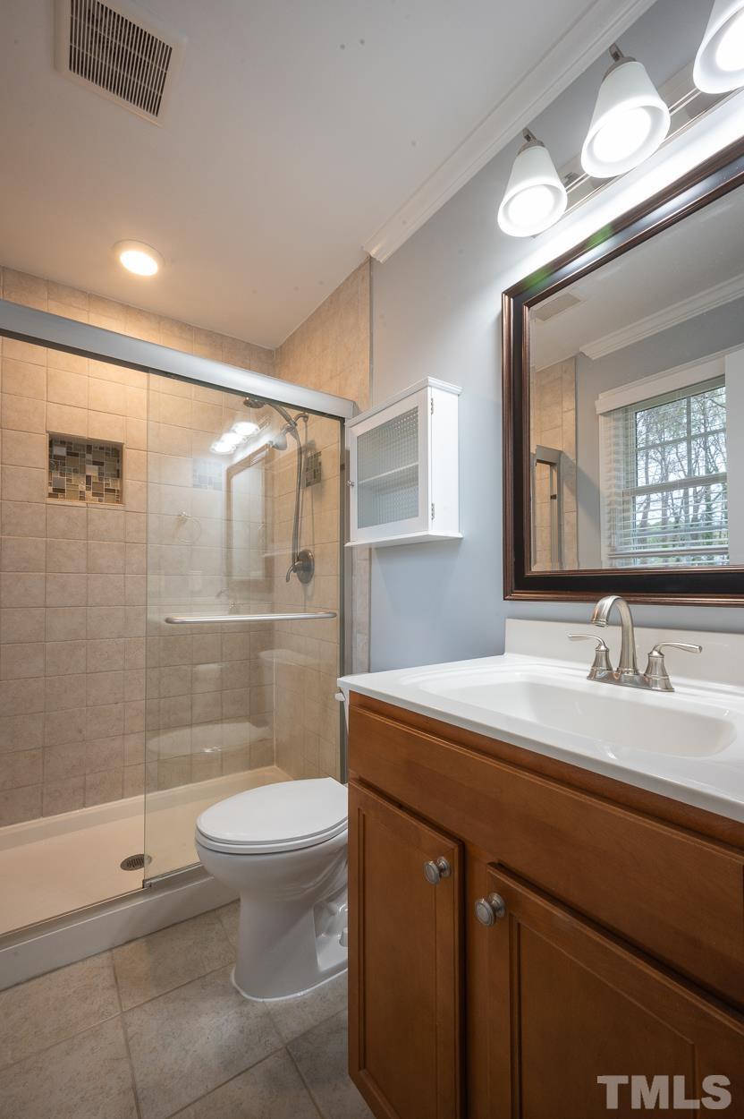 3400 Morningside Drive Raleigh, NC 27607 - Photo 21 of 21 a bathroom with a sink a toilet and shower