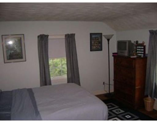 33 Barrows Road Reading, MA 01867 - Photo 7 of 11 a bedroom with a bed and a window
