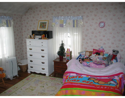 33 Barrows Road Reading, MA 01867 - Photo 8 of 11 a bedroom with a bed and a dresser