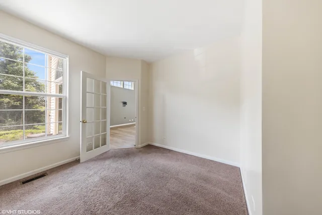 a view of an empty room with a window