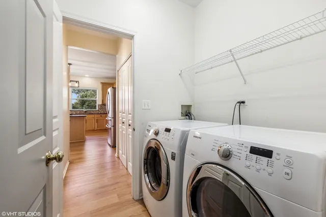 a view of storage and utility room with washer and dryer