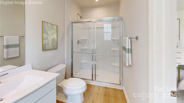 a bedroom with a bed a table and chair