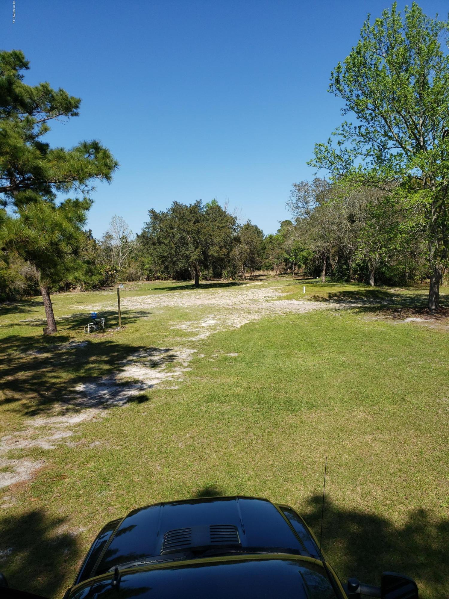 325 Dusty Road St. Augustine, FL 32095 - Photo 6 of 11 a view of an outdoor space and swimming pool
