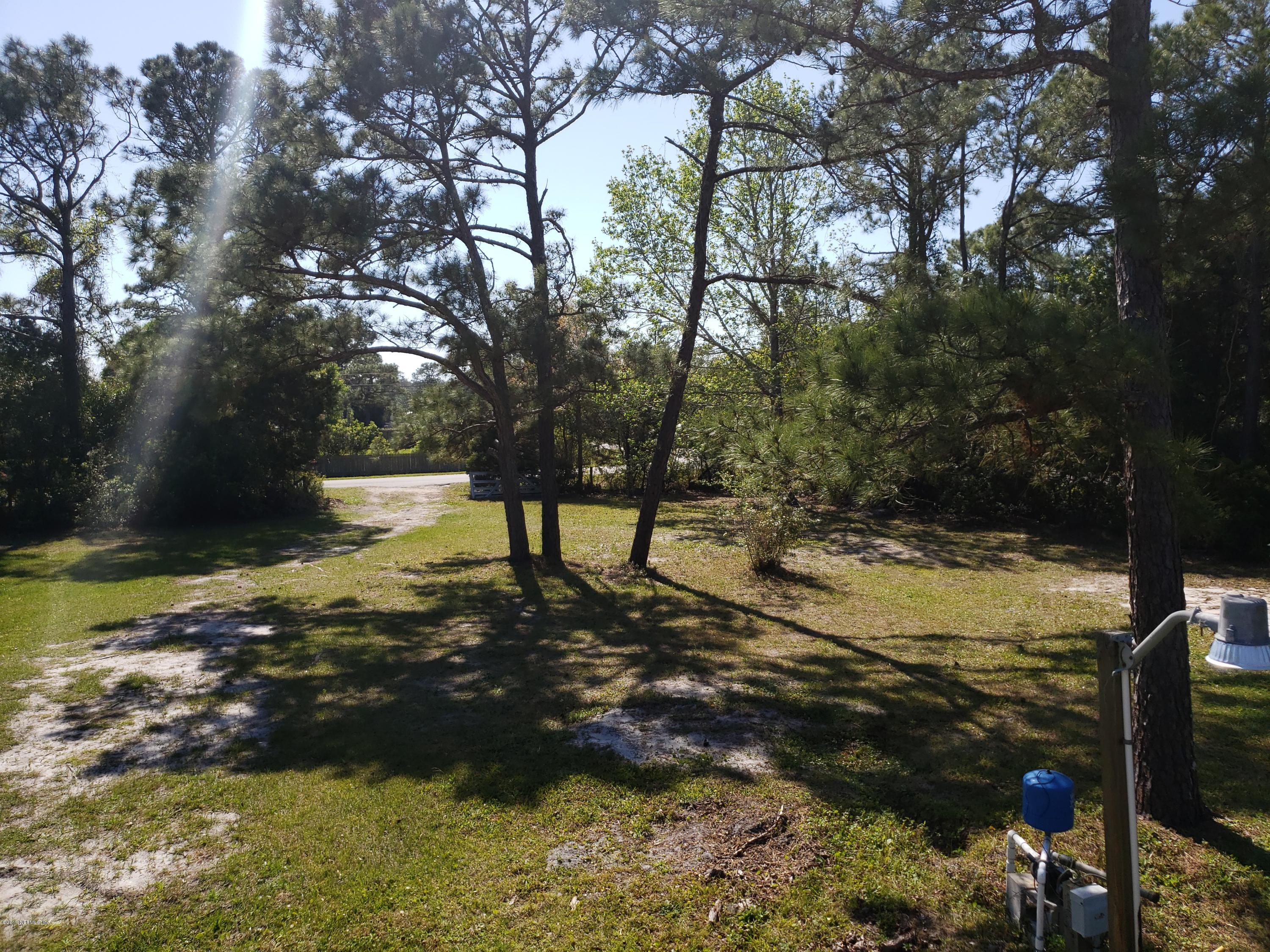 325 Dusty Road St. Augustine, FL 32095 - Photo 10 of 11 a view of yard with trees