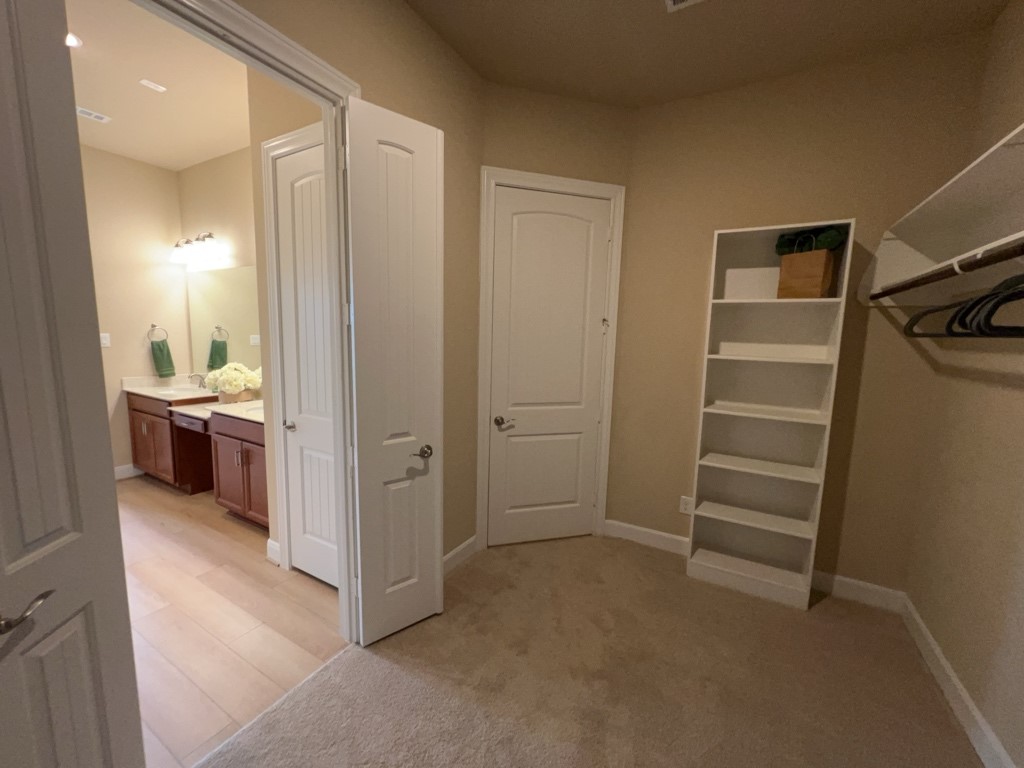 5602 Caracara Street Manvel, TX 77578 - Photo 18 of 27 a view of a room with a furniture and closet
