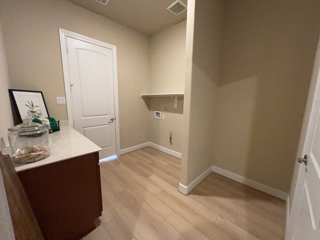5602 Caracara Street Manvel, TX 77578 - Photo 19 of 27 a view of a kitchen with a sink