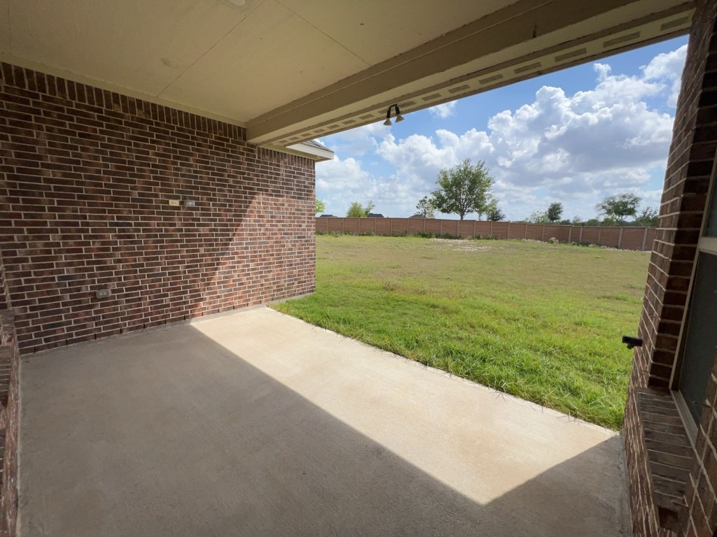 5602 Caracara Street Manvel, TX 77578 - Photo 22 of 27 a view of a yard with an outdoor space