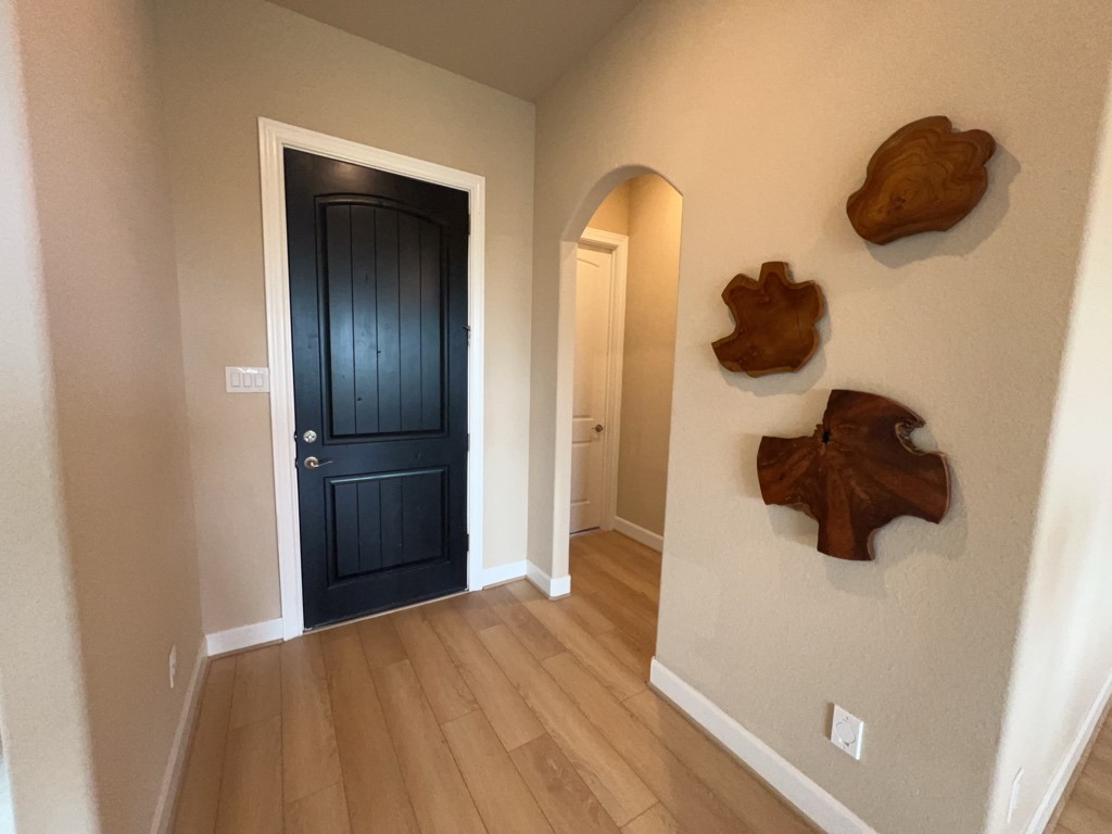 5602 Caracara Street Manvel, TX 77578 - Photo 4 of 27 a kitchen with a refrigerator and a cabinets