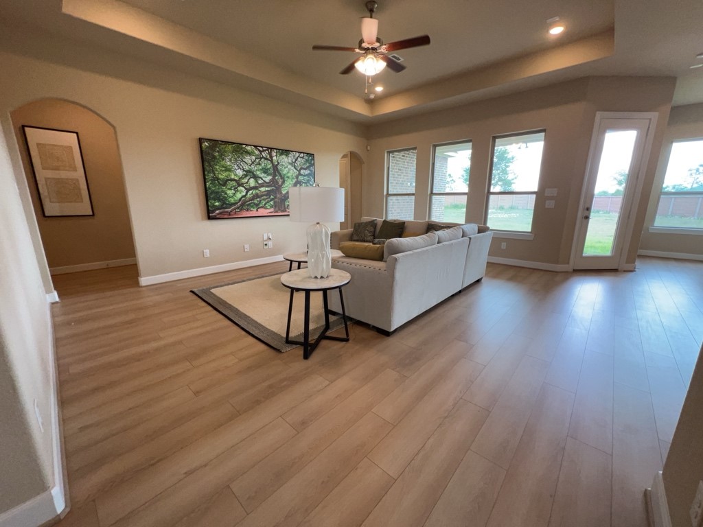 5602 Caracara Street Manvel, TX 77578 - Photo 6 of 27 a living room with couches and a wooden floor