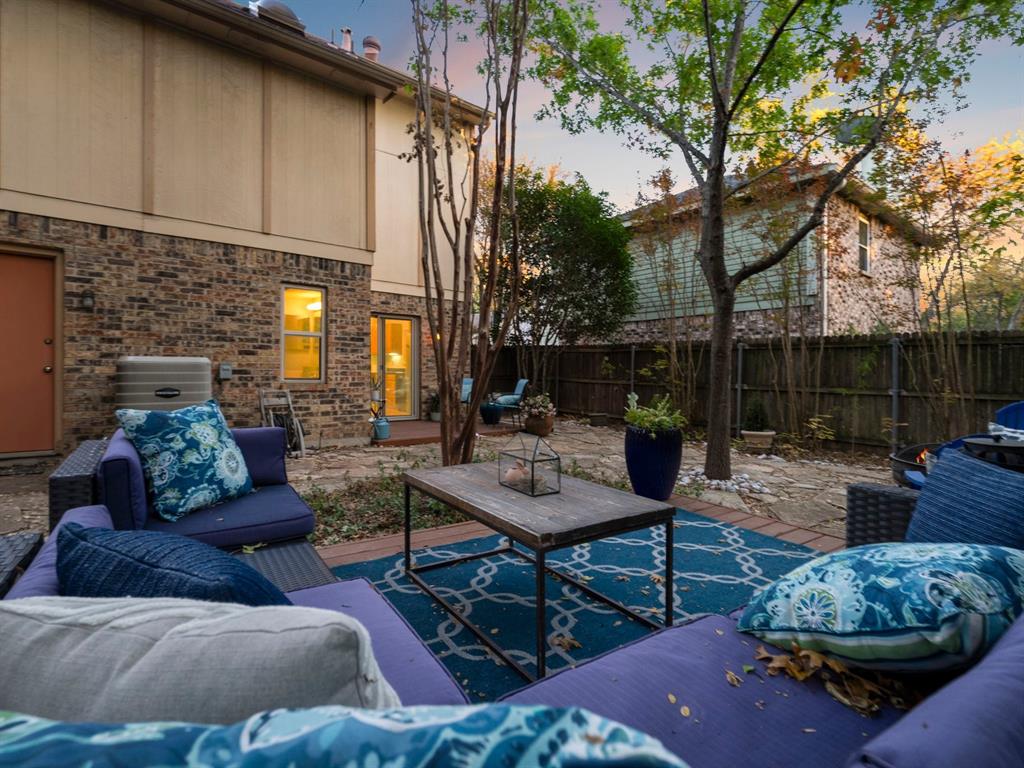 13347 Pandora Circle Dallas, TX 75238 - Photo 11 of 36 a outdoor space with patio couches and a fireplace