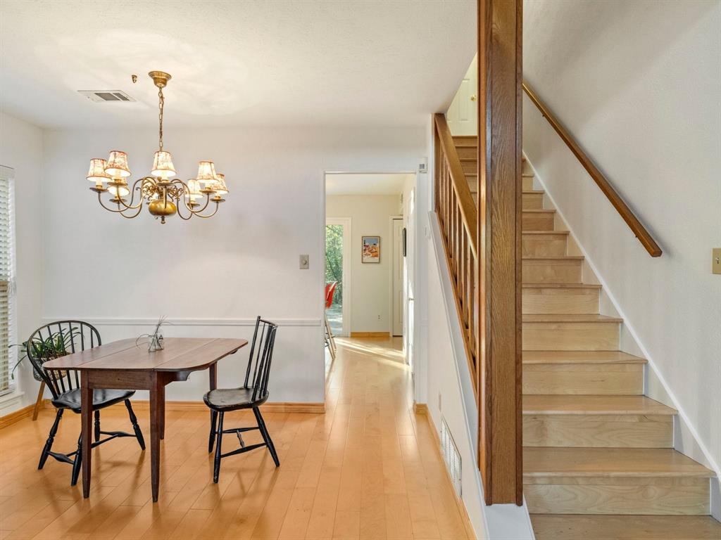13347 Pandora Circle Dallas, TX 75238 - Photo 17 of 36 a dining room with furniture entryway and wooden floor