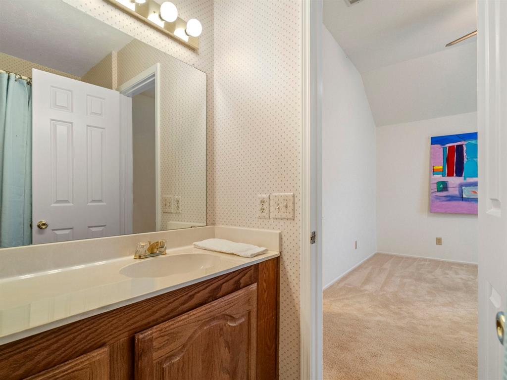 13347 Pandora Circle Dallas, TX 75238 - Photo 19 of 36 a bathroom with a sink and a mirror
