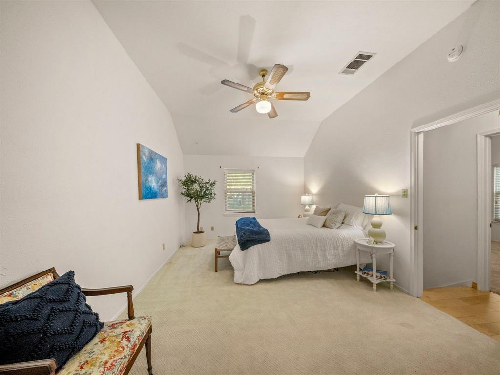 13347 Pandora Circle Dallas, TX 75238 - Photo 20 of 36 a bedroom with furniture and a chandelier fan