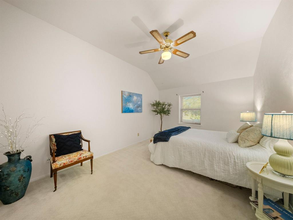 13347 Pandora Circle Dallas, TX 75238 - Photo 21 of 36 a bedroom with a bed and a window