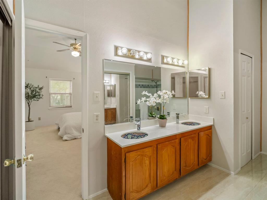 13347 Pandora Circle Dallas, TX 75238 - Photo 22 of 36 a bathroom with a sink double vanity and a mirror