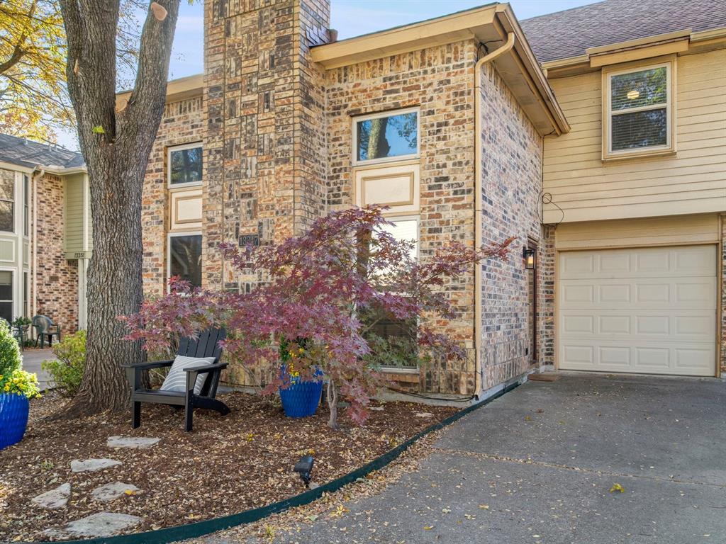 13347 Pandora Circle Dallas, TX 75238 - Photo 35 of 36 a view of a brick house with many windows