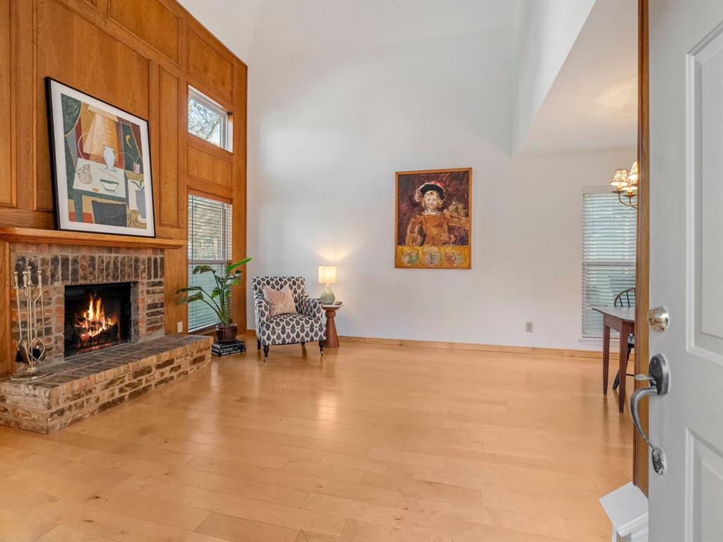 13347 Pandora Circle Dallas, TX 75238 - Photo 6 of 36 a living room with furniture and a fireplace