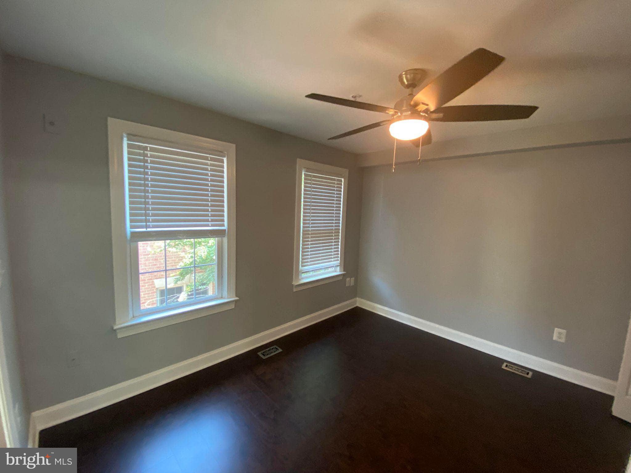 2256 South Garfield Street, Unit 11 Arlington, VA 22206 - Photo 15 of 21 a view of an empty room with wooden floor and a window