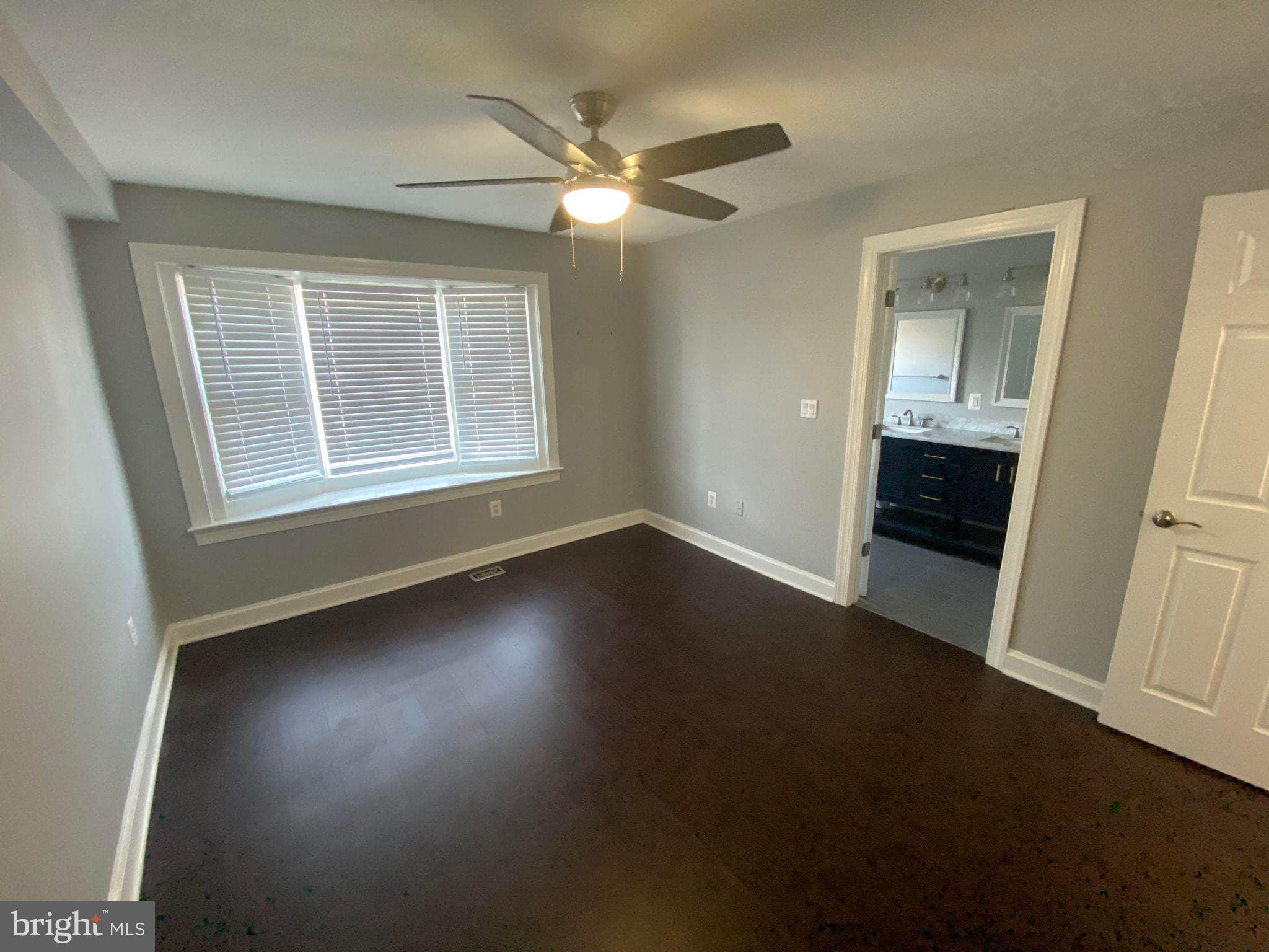 2256 South Garfield Street, Unit 11 Arlington, VA 22206 - Photo 16 of 21 a view of a livingroom with wooden floor and a ceiling fan
