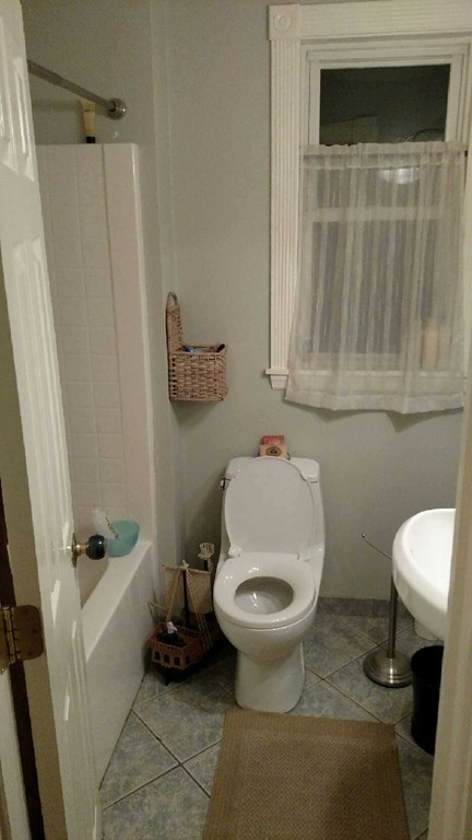 6 Newbury Street Beverly, MA 01915 - Photo 11 of 13 a bathroom with a toilet and a shower