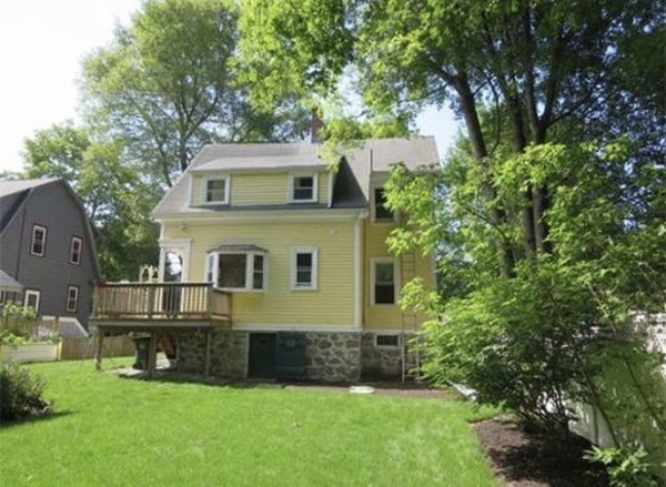 6 Newbury Street Beverly, MA 01915 - Photo 2 of 13 a front view of a house with a yard