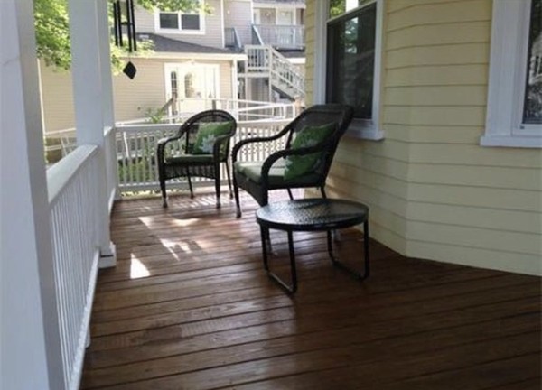 6 Newbury Street Beverly, MA 01915 - Photo 4 of 13 a balcony with table and chairs