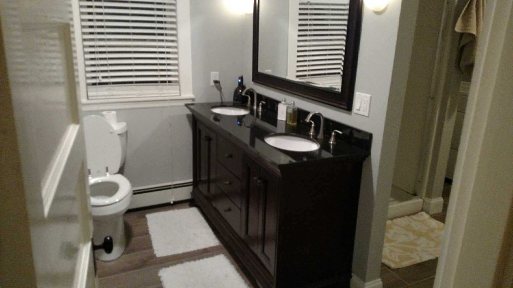 6 Newbury Street Beverly, MA 01915 - Photo 9 of 13 a bathroom with a sink and a mirror