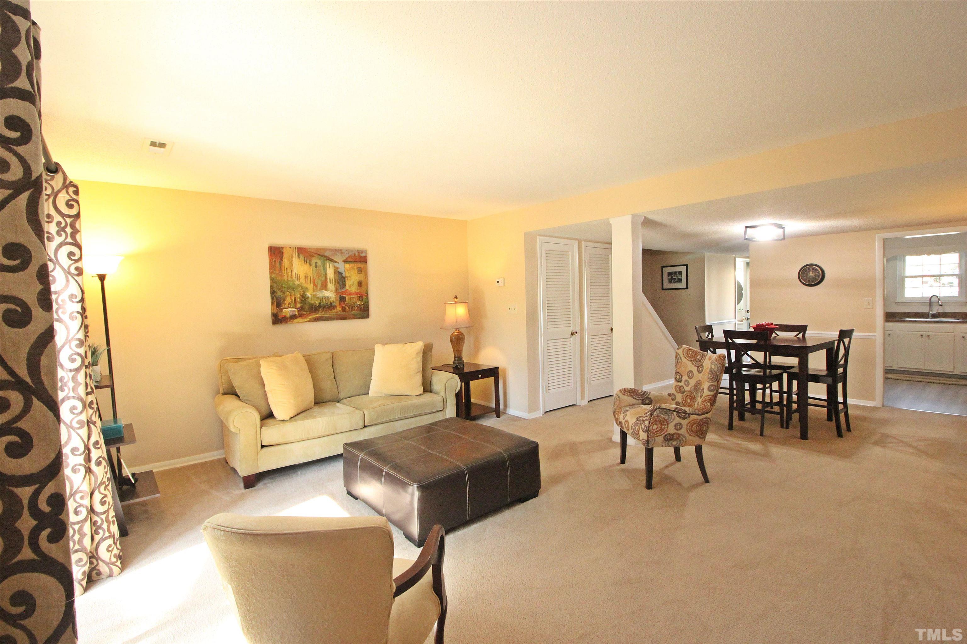 1204 Falls Church Road, Unit C Raleigh, NC 27609 - Photo 11 of 26 a living room with furniture and a table
