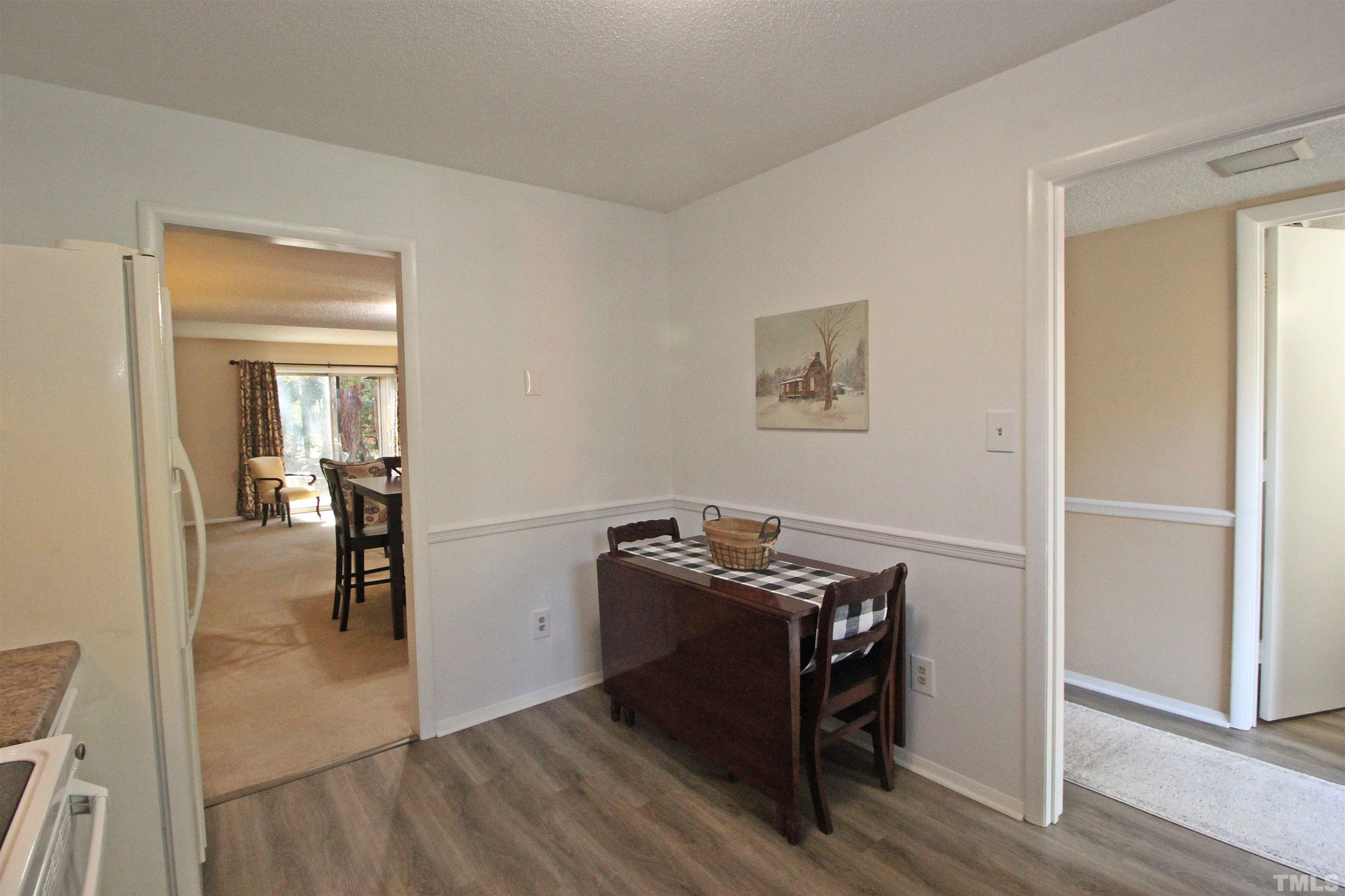 1204 Falls Church Road, Unit C Raleigh, NC 27609 - Photo 15 of 26 a view of a livingroom with wooden floor and a sink