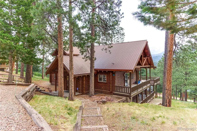 a view of a house with a yard covered in snow