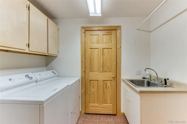 a bedroom with a bed and a view of en suite bathroom