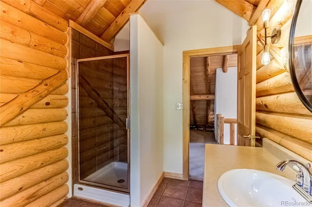 a view of a balcony with wooden floor and fence