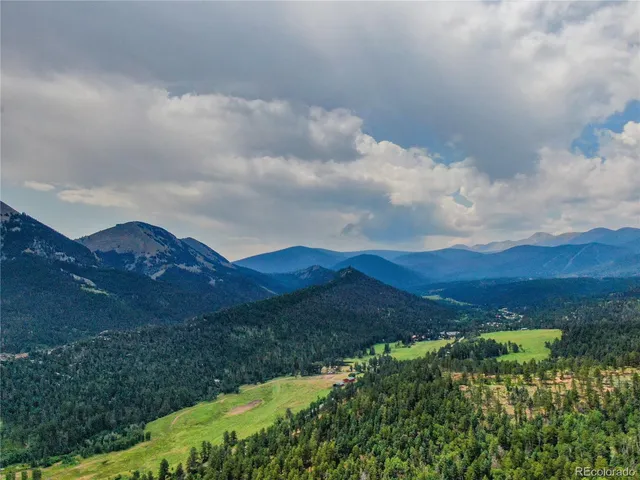 a view of a lush green mountain