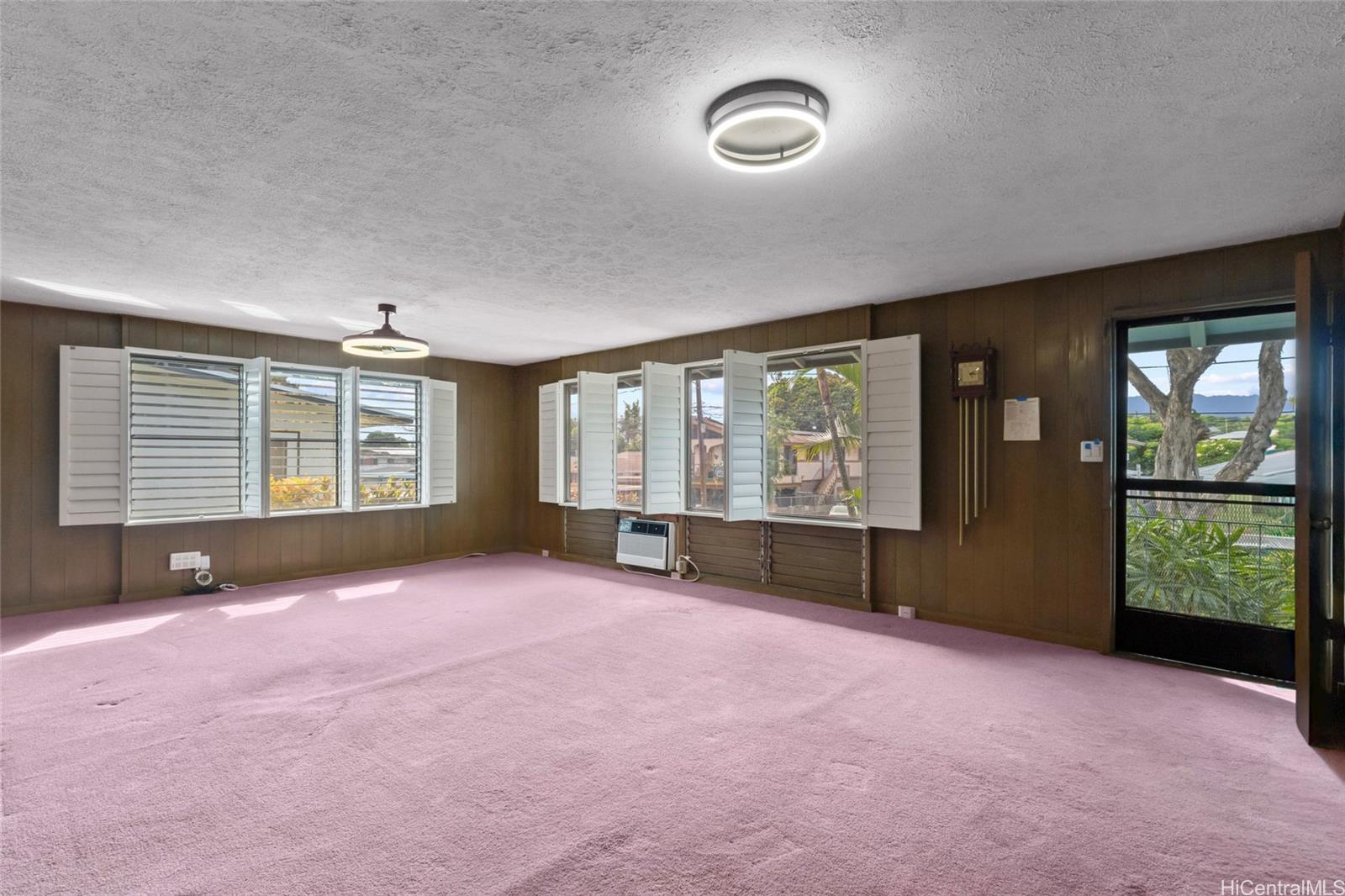 94-341 Kahuanani Street Waipahu, HI 96797 - Photo 2 of 24 an empty room with windows